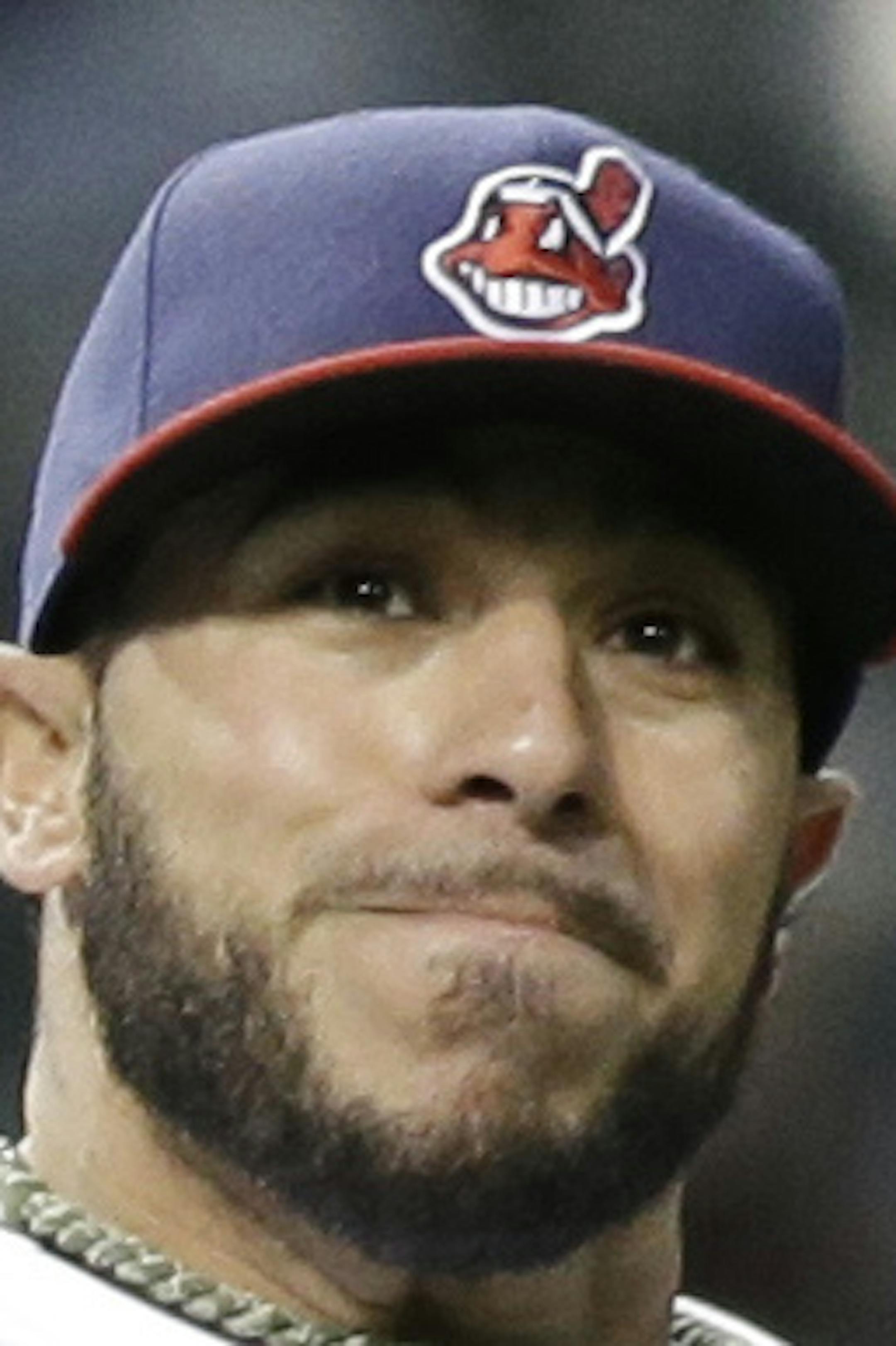 Cleveland Indians' Mike Aviles throws out Chicago White Sox's Dayan Viciedo at first base in the seventh inning of a baseball game on Friday, May 2, 2014, in Cleveland. (AP Photo/Tony Dejak)