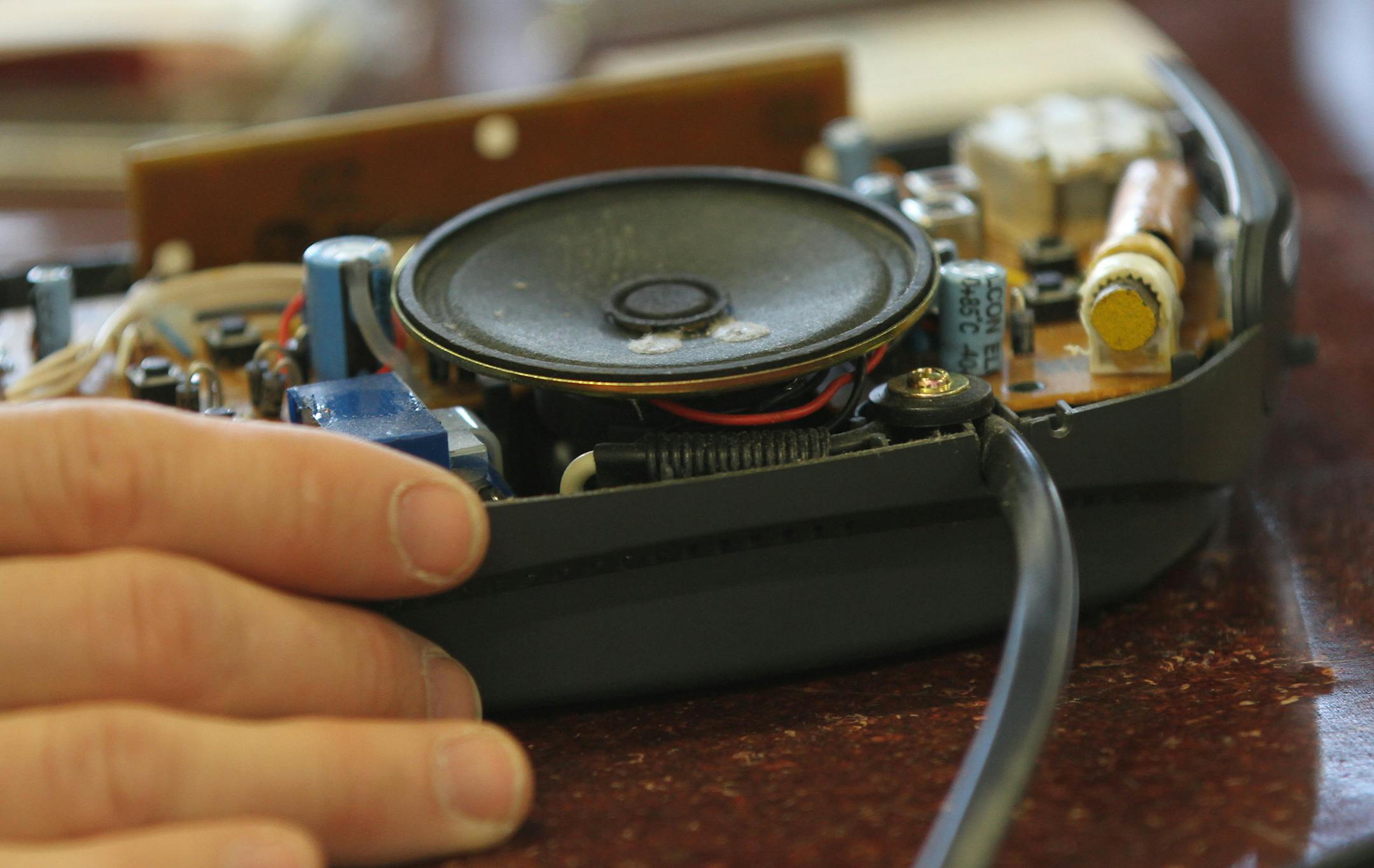 A small clock radio was taken apart during the Hennepin County Fix-It Clinics where residents bring in small household appliances, electronics, clothing and mobile devices for repair. The Fix-It Clinic as held at The Mill, a workshop in north Minneapolis on 12/8/12.] Bruce Bisping/Star Tribune bbisping@startribune.com Jorge Grauvilardell, Karen Grimm/source