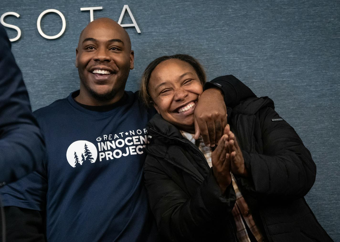 Marvin Haynes wraps arm around his sister Marvina Haynes, who tirelessly fought for his exoneration, as Innocence Project attoney Andrew Markquart speaks to the press on Monday, Dec. 11, 2023 in Minneapolis, Minn. After serving 20 years in prison from the age 16, Marvin Haynes was exonerated of a murder conviction and released on Monday, Dec. 11, 2023. ] RENEE JONES SCHNEIDER • renee.jones@startribune.com