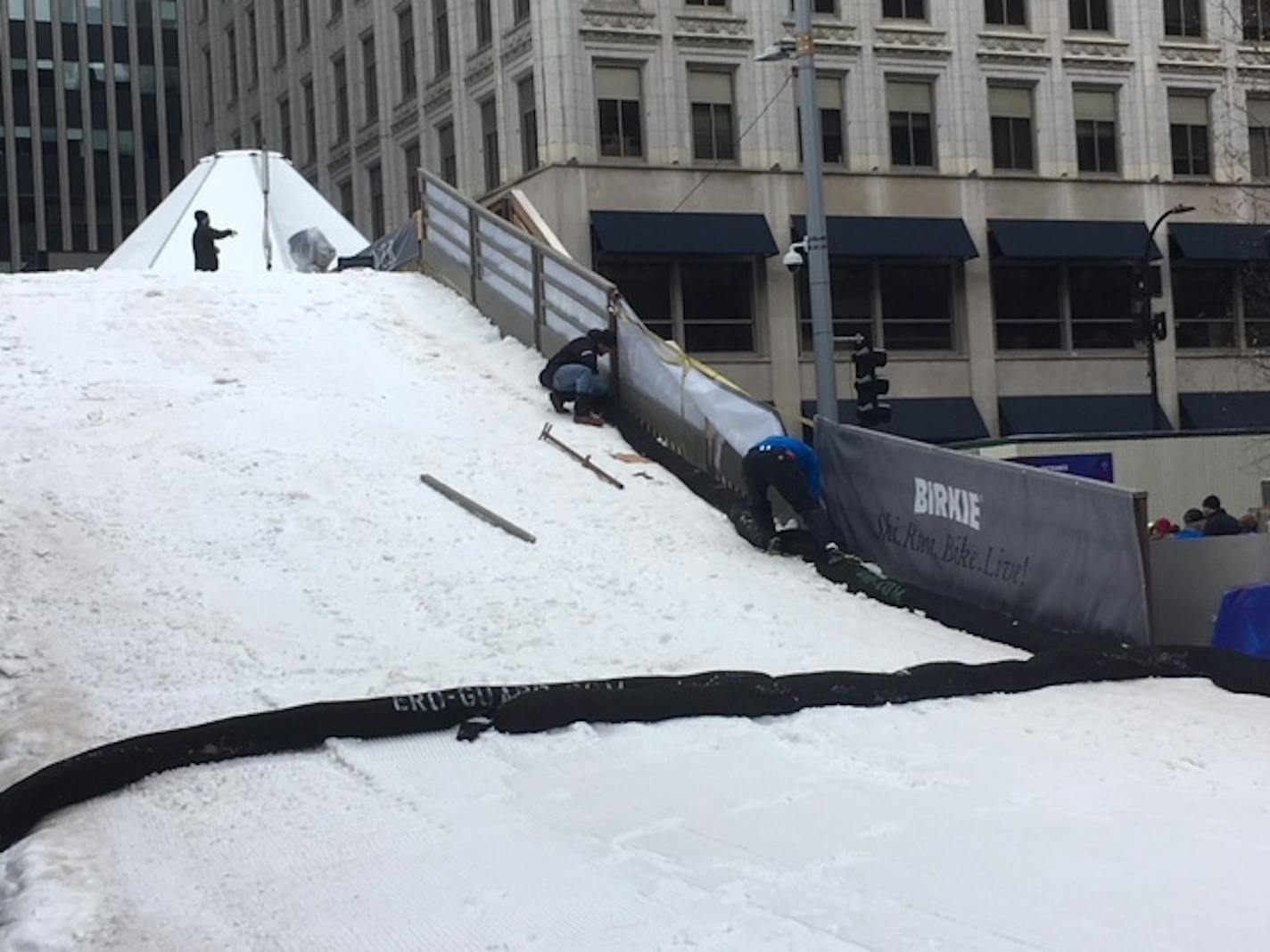 A crew worked to replace a railing on the Birkebeiner Bridge on Saturday afternoon on Nicollet Mall in downtown Minneapolis. The bridge was closed because of ice after Friday's thaw.