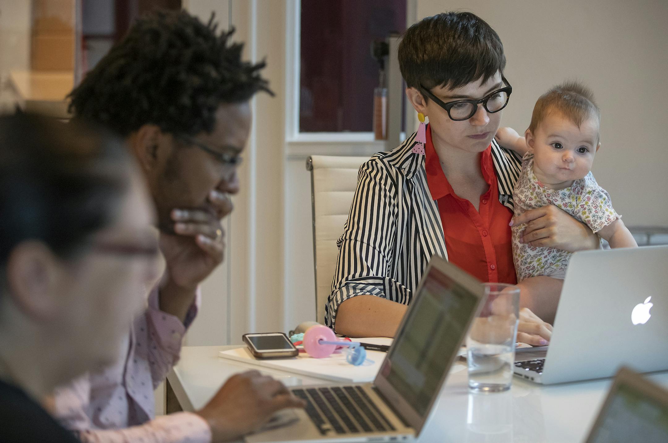 Pollen Executive Director Jamie Millard, right, with her child Dani, offers employees a variety of benefits, including "summer Fridays."