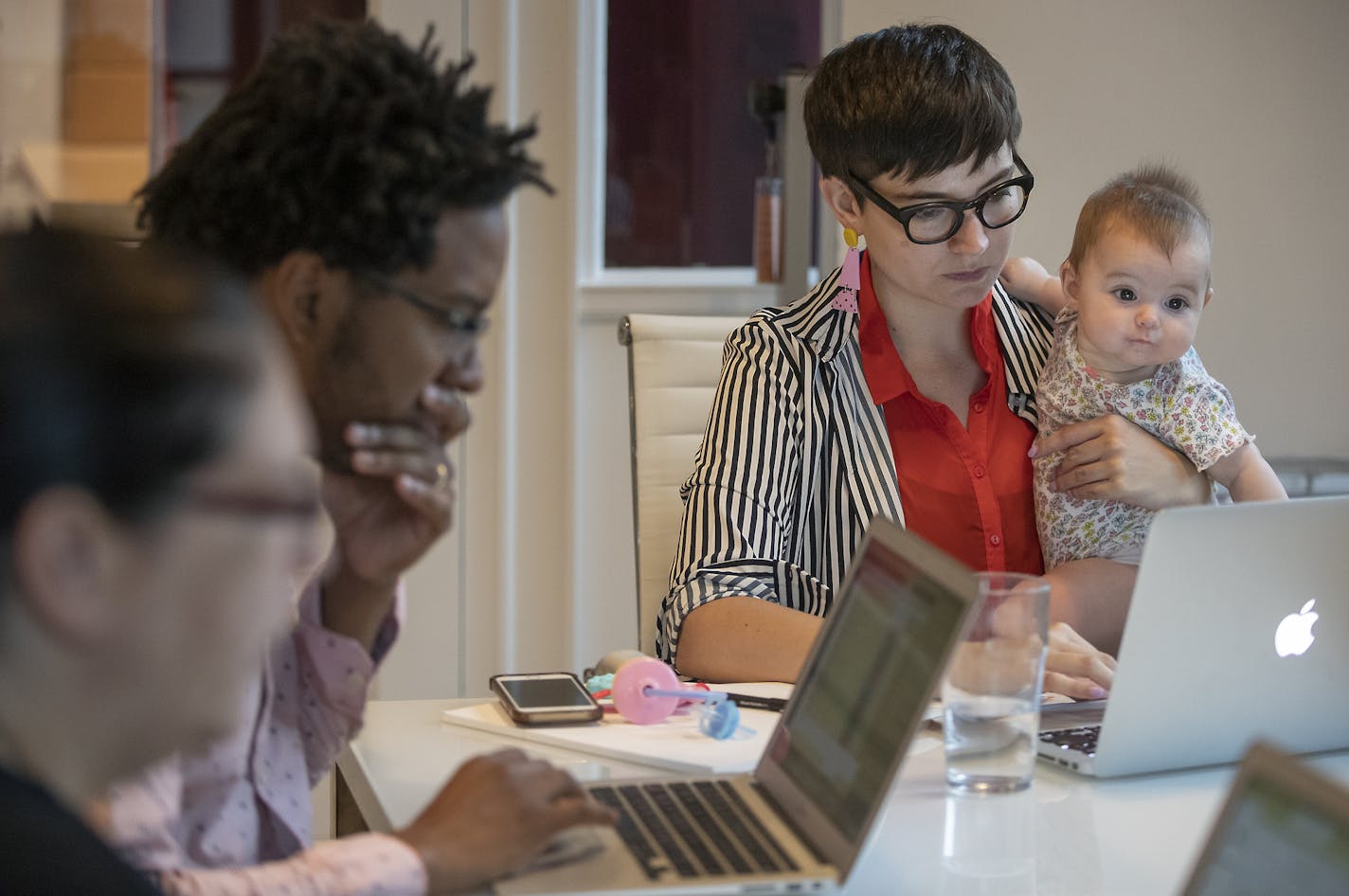 Pollen Executive Director Jamie Millard, right, with her child Dani, offers employees a variety of benefits, including "summer Fridays."