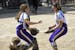 Rochester Lourdes catcher Veronica Taylor (10) and pitcher Anna Taylor (12) celebrated their team's 2A championship victory over Norwood-Young America