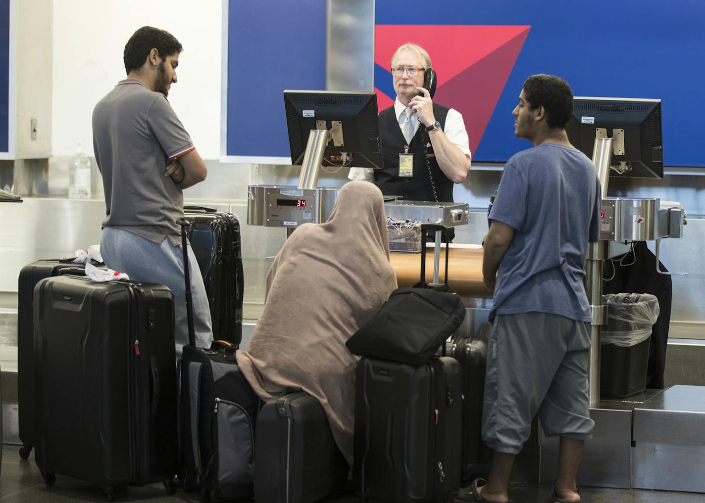 People wait in line at the check in area for Delta at MSP Airport. ] (Leila Navidi/Star Tribune) leila.navidi@startribune.com BACKGROUND INFORMATION: At Minneapolis - St. Paul International Airport on Monday, August 8, 2016. A power outage in Atlanta, which began at approximately 2:30 AM EST impacted Delta computer systems and operations worldwide, resulting in massive flight delays and cancellations.