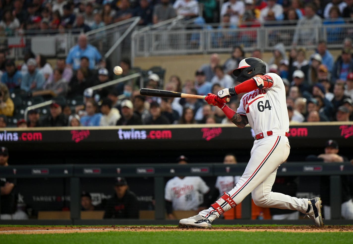 Minnesota Twins third baseman Jose Miranda (64) hits an RBI single, bring in a run by designated hitter Byron Buxton (25) in the bottom of the fourth inning against the San Diego Padres Tuesday, May 9, 2023, at Target Field in Minneapolis, Minn.. ] AARON LAVINSKY • aaron.lavinsky@startribune.com