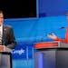Republican presidential candidate Rep. Michele Bachmann, R-Minn., makes a comment as former Massachusetts Gov. Mitt Romney listens during a debate Thu