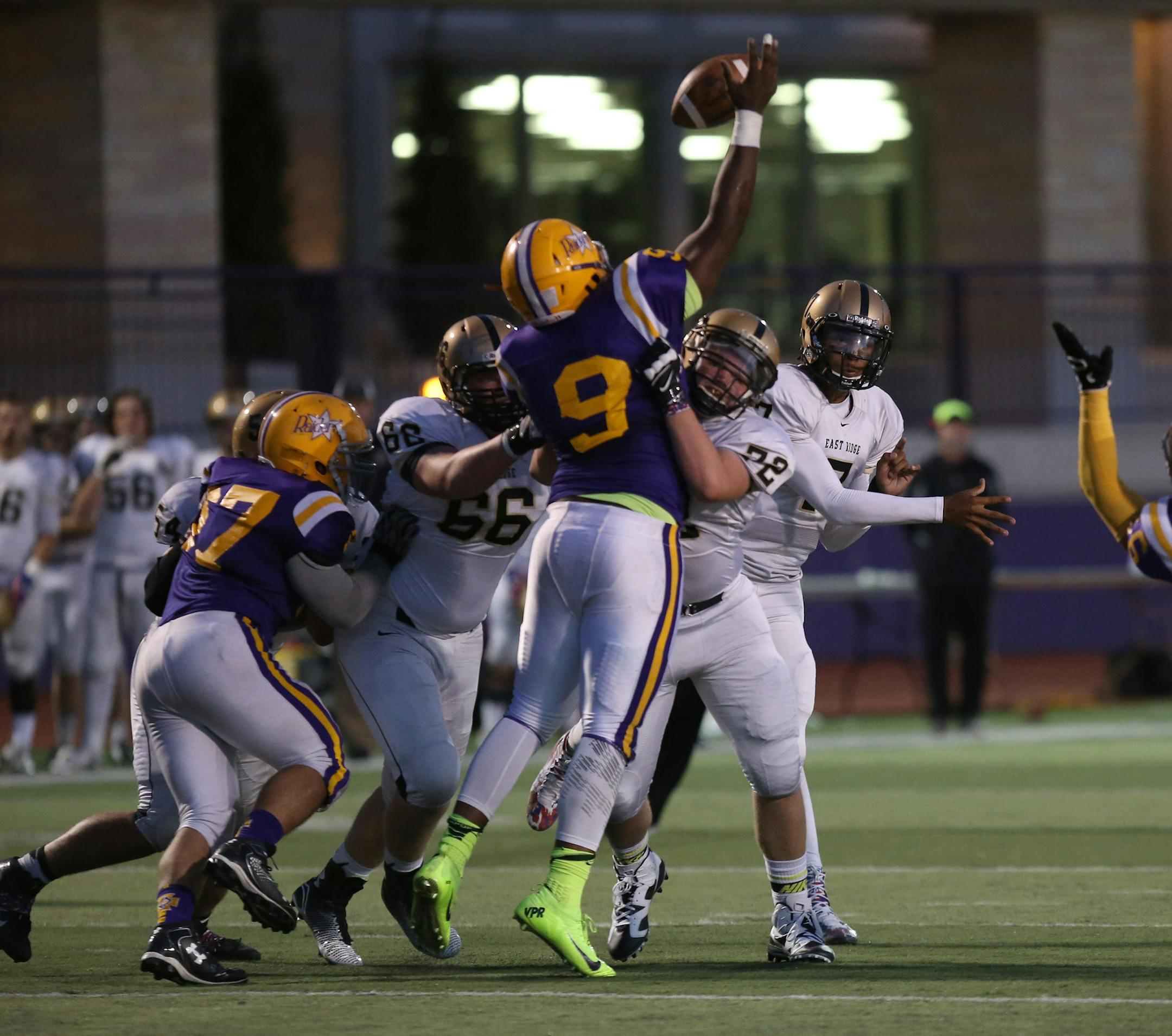 East Ridge quarterback Seth Green got his pass knocked down by Cretin-Derham Hall Jashon Cornell in the first half. ] (KYNDELL HARKNESS/STAR TRIBUNE) kyndell.harkness@startribune.com Cretin-Derham Hall vs East Ridge in St. Paul Min., Friday, August, 5, 2014.