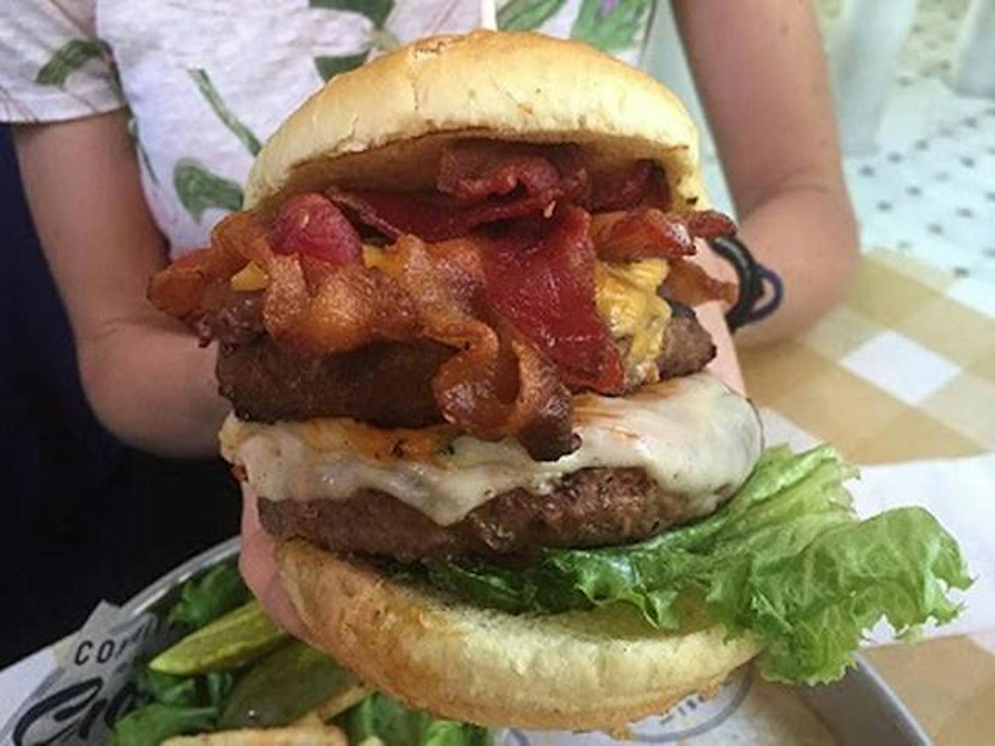 The Whole Hog Burger from Uno Pizzeria & Grill's menu is "over a pound of meat," including bacon, prosciutto and pepperoni. Add to that four types of cheese, garlic mayo, pickles, a side of fries and onion rings, and the total calories come to 2,850.