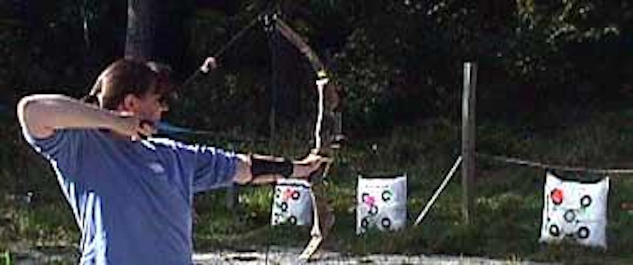 MN BOW workshop participant learning archery skills