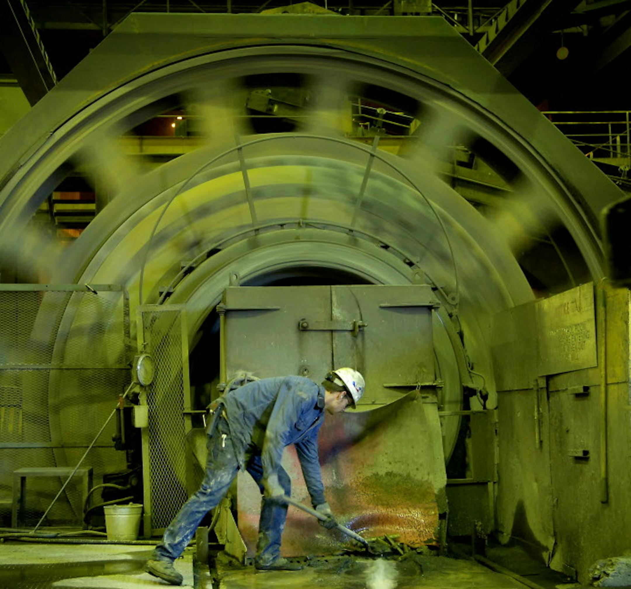 GLEN STUBBE ‘ gstubbe@startribune.com MONDAY, October 2, 2006 -- Forbes, Minn. -- Chan Paine shoveled broken crusher rods from an opening in one the rotating mills that reduce taconite ore to powder. Paine, 20, was one of 24 new workers to be hired at United Taconite, the first new hires in 13 years.