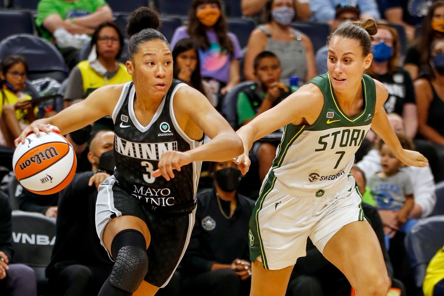 Minnesota Lynx guard Aerial Powers (3) works past Seattle Storm forward Stephanie Talbot (7) to the basket in the first quarter of a WNBA basketball game Tuesday, Aug. 24, 2021, in Minneapolis. (AP Photo/Bruce Kluckhohn)