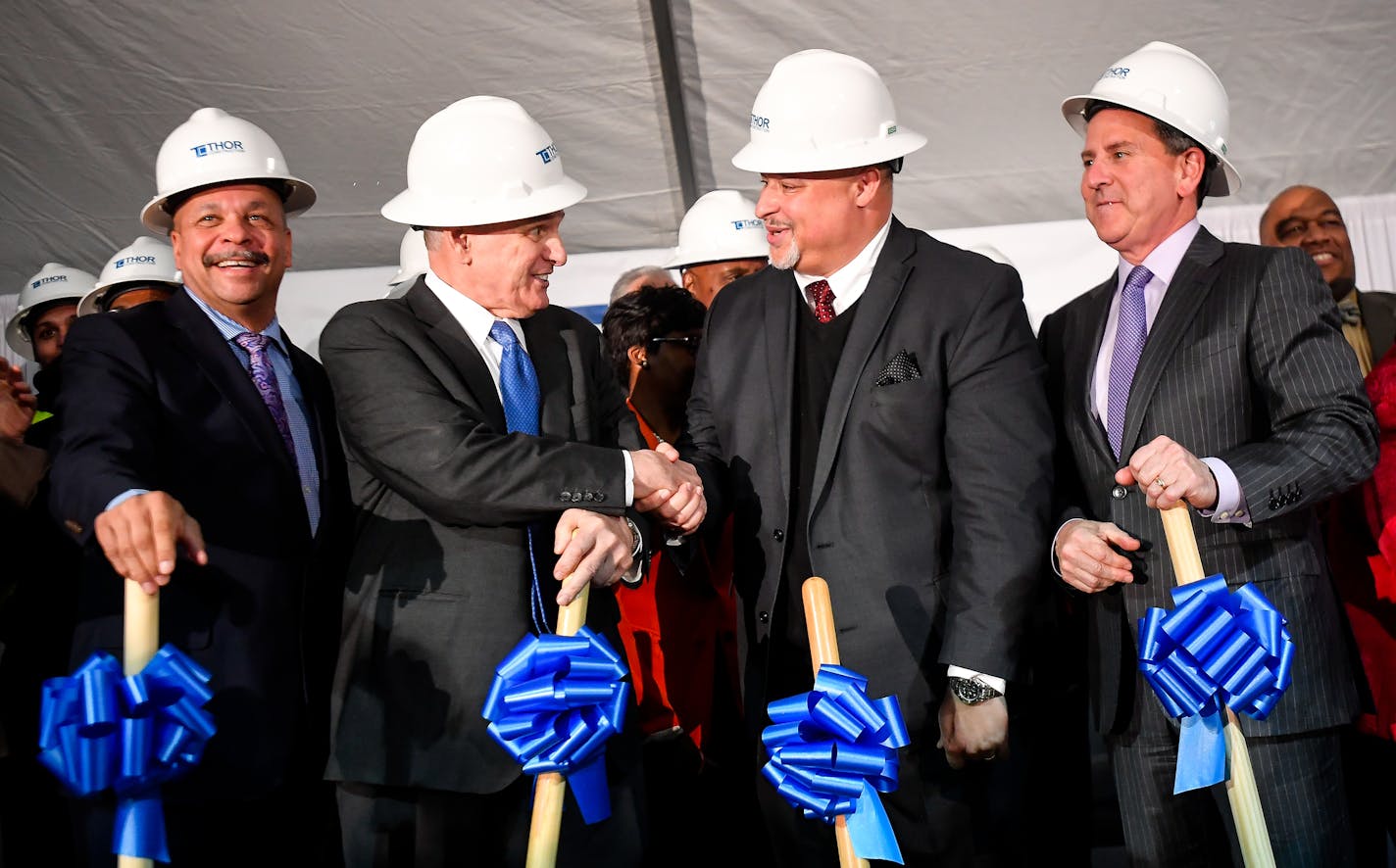 From left, THOR Companies Chairman Richard Copeland, Gov. Mark Dayton, THOR Companies CEO Ravi Norman and Target CEO Brian Cornell shook hands following Tuesday's ceremonial groundbreaking photo op. ] (AARON LAVINSKY/STAR TRIBUNE) aaron.lavinsky@startribune.com Target Corp is an unspecified "partner" in the planned headquarters-retail complex on the near northside on which Thor Companies will break ground at 1:30 p.m. Tuesday. Target, which abandoned a north side store on W. Broadway Avenue in 2