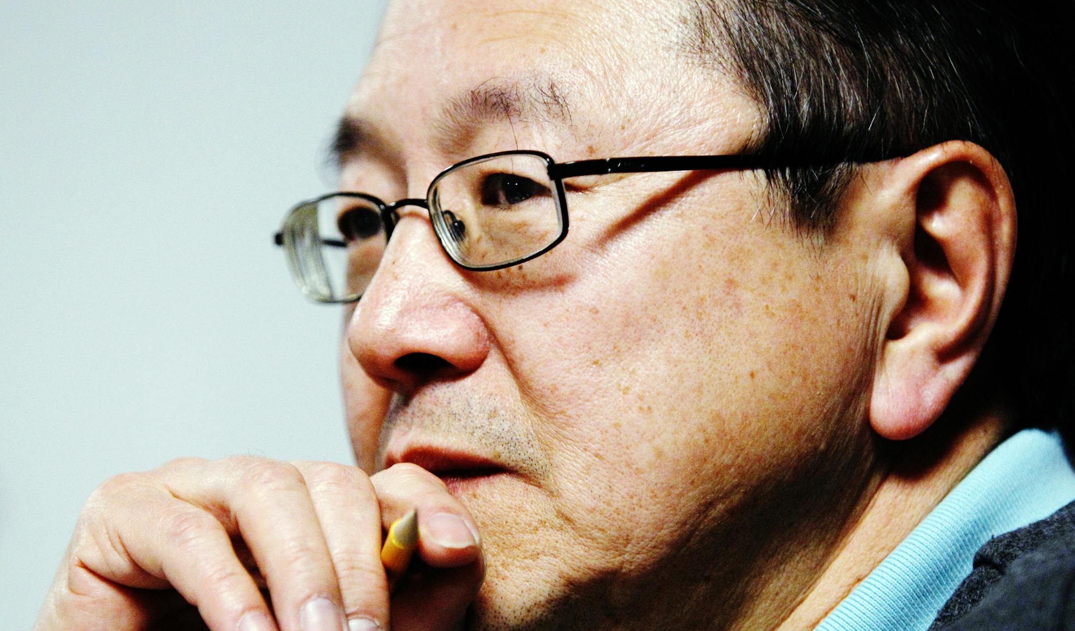 Rick Shiomi, writer and director of the play "Yellow Fever", watches the production's rehearsal at Mu Performing Arts Friday, March 1, 2013 in Minneapolis. The play launched the career of Shiomi and marks his final production as Mu's artistic director. (Genevieve Ross/Special to the Star Tribune) ORG XMIT: 2STAGE031813