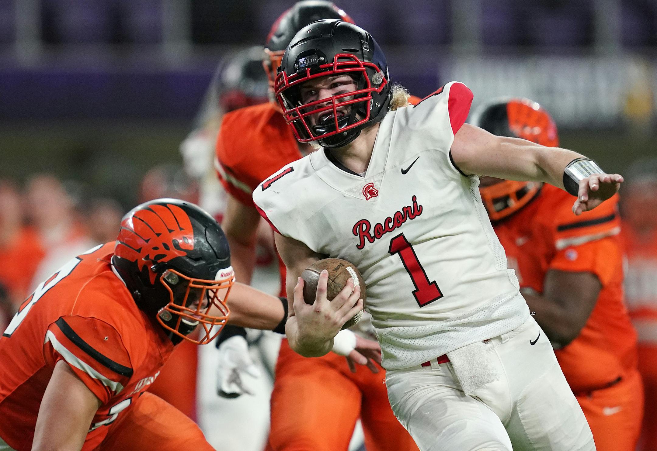 Rocori quarterback Jack Steil (1) dodged the Winona defense as he sprinted towards the end zone with the ball in the first half. ] ANTHONY SOUFFLE &#x2022; anthony.souffle@startribune.com Rocori played Winona in a MSHSL Class 4A semifinal football game Friday, Nov. 15, 2019 at U.S. Bank Stadium in Minneapolis.