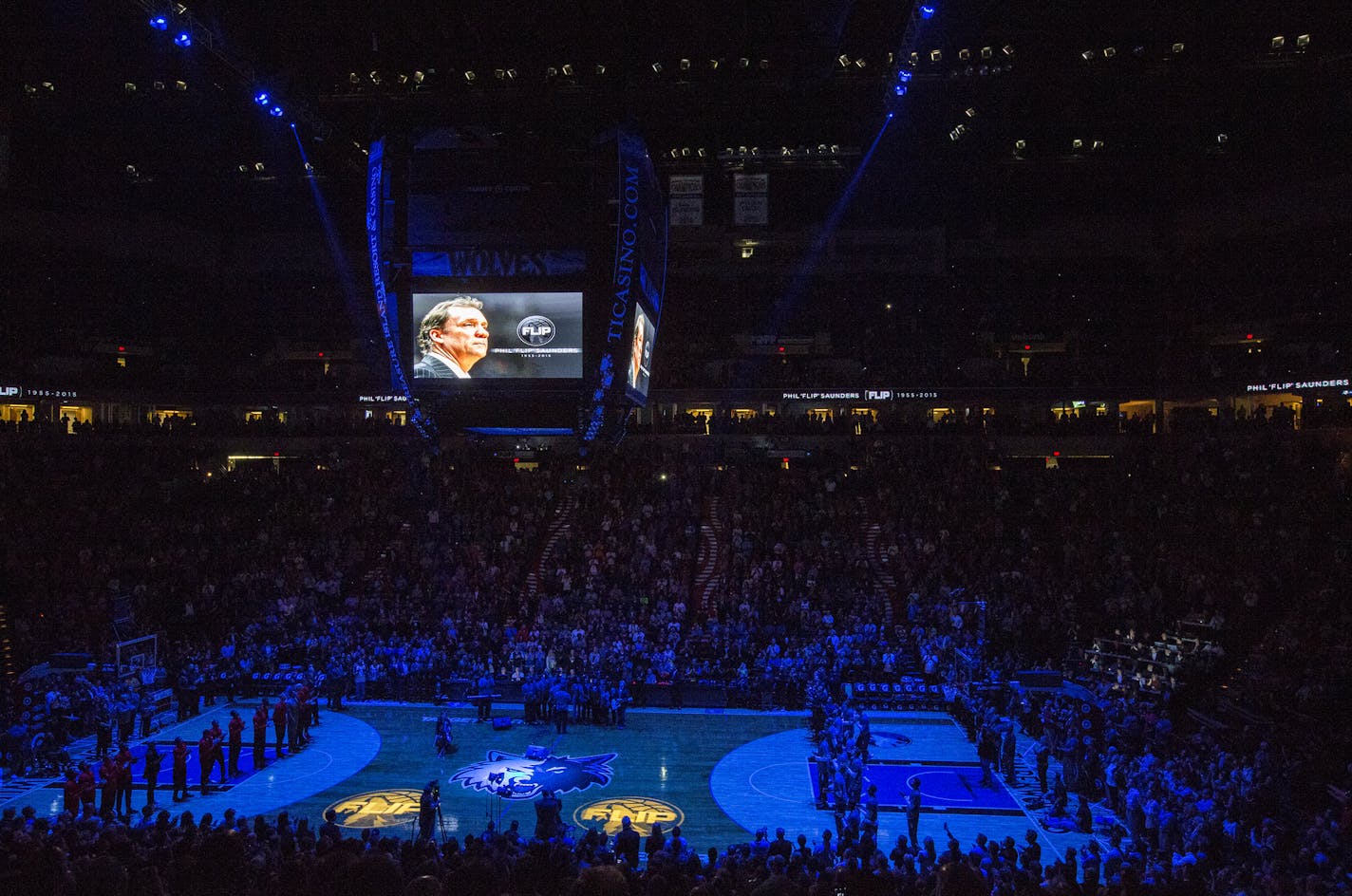 All eyes were focused upward in a dimly lit Target Center on Monday night as Timberwolves fans took part in a pregame tribute to former coach and executive Flip Saunders.