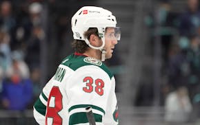 Minnesota Wild right wing Ryan Hartman stands on the ice after the team's NHL hockey game against the Seattle Kraken, Thursday, Oct. 28, 2021, in Seat