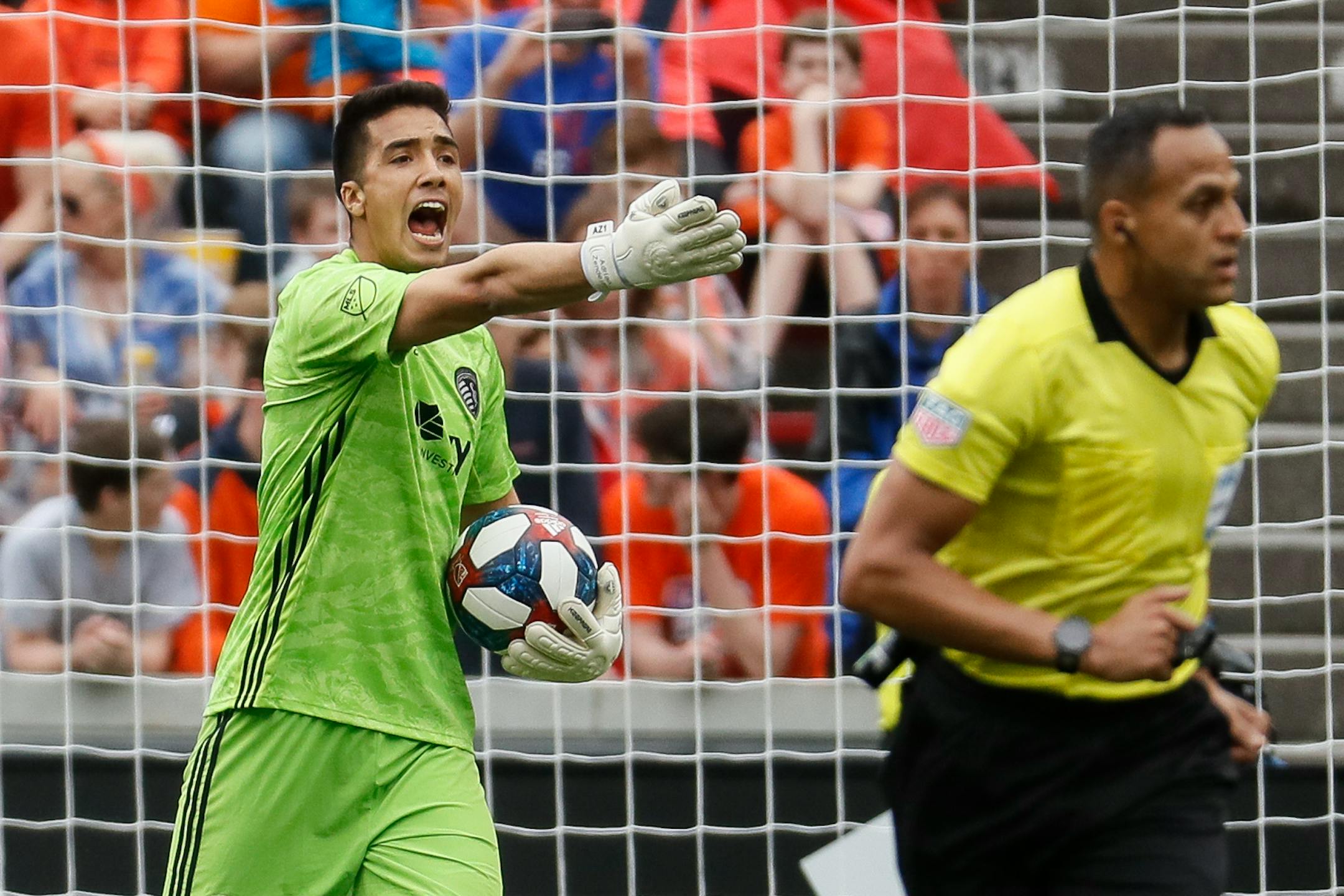 Sporting Kansas City goalkeeper Adrian Zendejas, left, reacts in the first half of an MLS soccer match against the FC Cincinnati, Sunday, April 7, 2019, in Cincinnati. (AP Photo/John Minchillo)