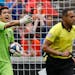 Sporting Kansas City goalkeeper Adrian Zendejas, left, reacts in the first half of an MLS soccer match against the FC Cincinnati, Sunday, April 7, 201