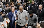 Bill Cosby arrives at court to face a felony charge of aggravated indecent assault on Wednesday in Elkins Park, Pa.