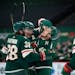 Minnesota Wild defenseman Jared Spurgeon (46) went for a boisterous hug of teammate Ryan Suter (20) to celebrate after Suter scored in the second peri