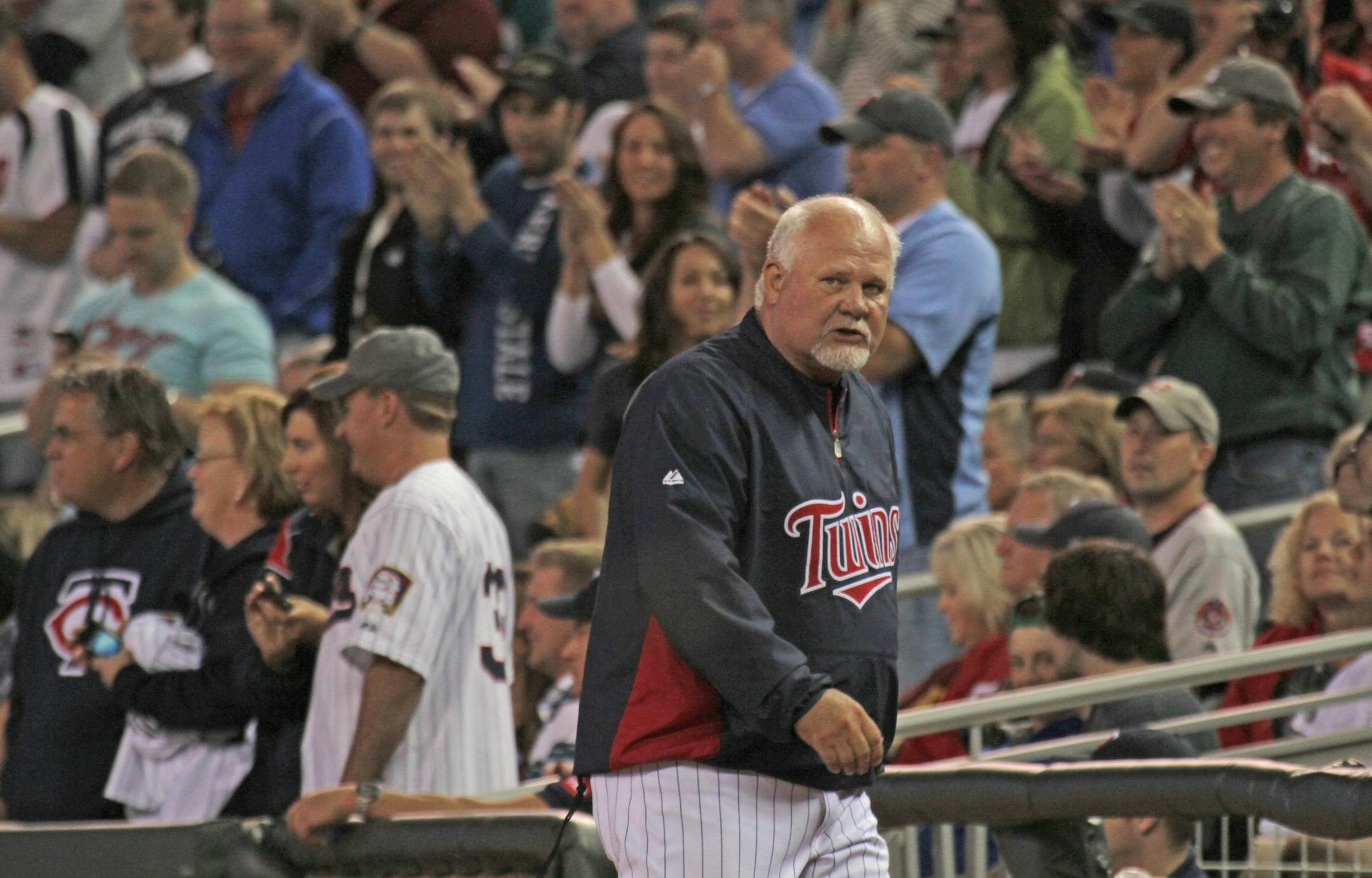 Minnesota Twins vs. Detroit Tigers, 5/25/12. (left to right) Twin Manager Ron Gardenhire headed to the locker room after he was ejected from the game by first base ump Alan Porter after a close call in the 8th inning.