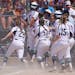 Rosemount's Paige Zender (5) celebrated with her teammates as she crossed home plate after hitting a grand slam in the fifth inning of the Class 4A ch