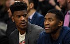 Minnesota Timberwolves guard Jimmy Butler (23) and guard Jamal Crawford (11) sat out Saturday night's game against Toronto with injuries. ] AARON LAVI