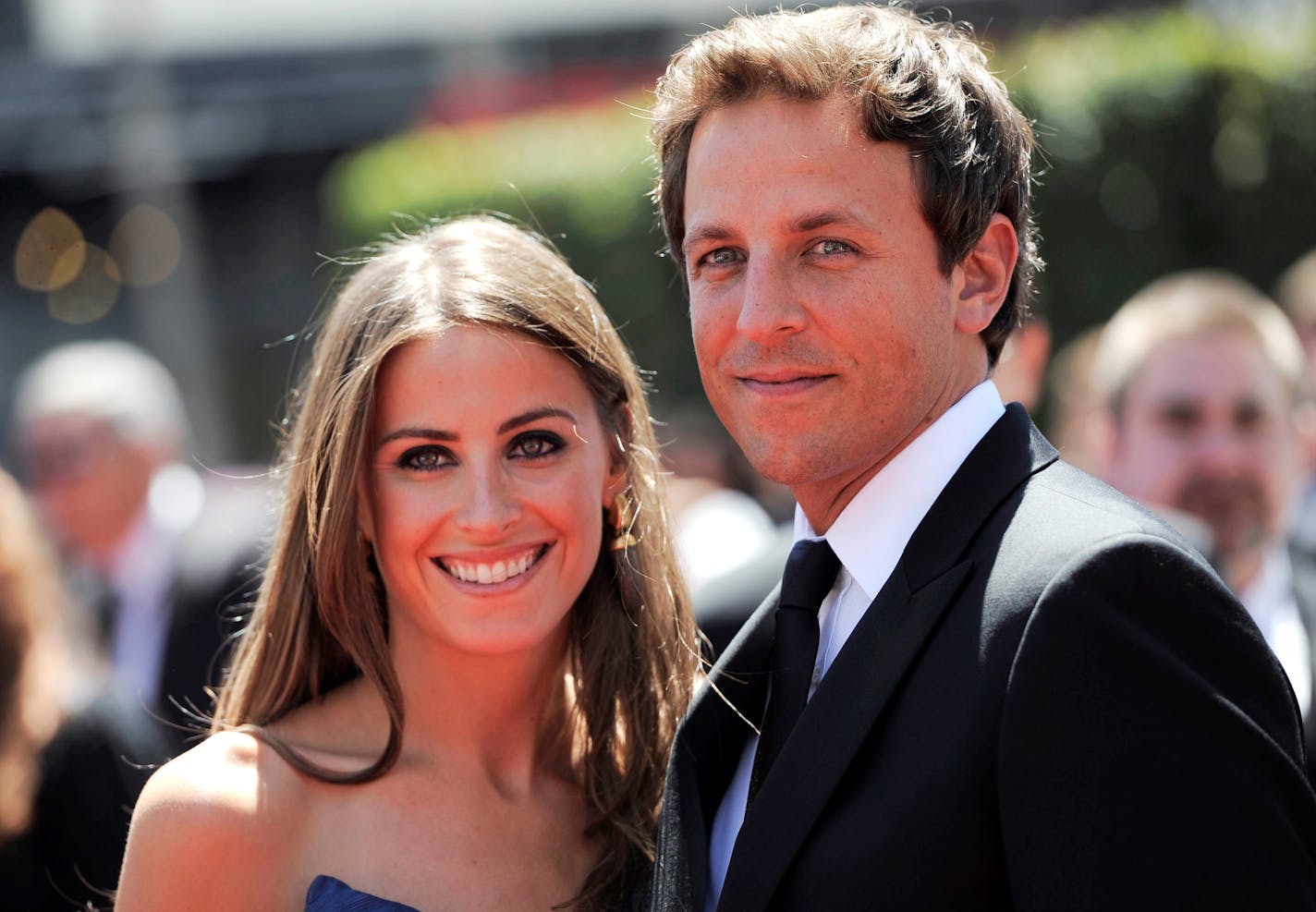 Seth Meyers, right, and a guest arrive at the Creative Arts Emmy Awards on Saturday, Aug. 21, 2010 in Los Angeles. (AP Photo/Chris Pizzello)