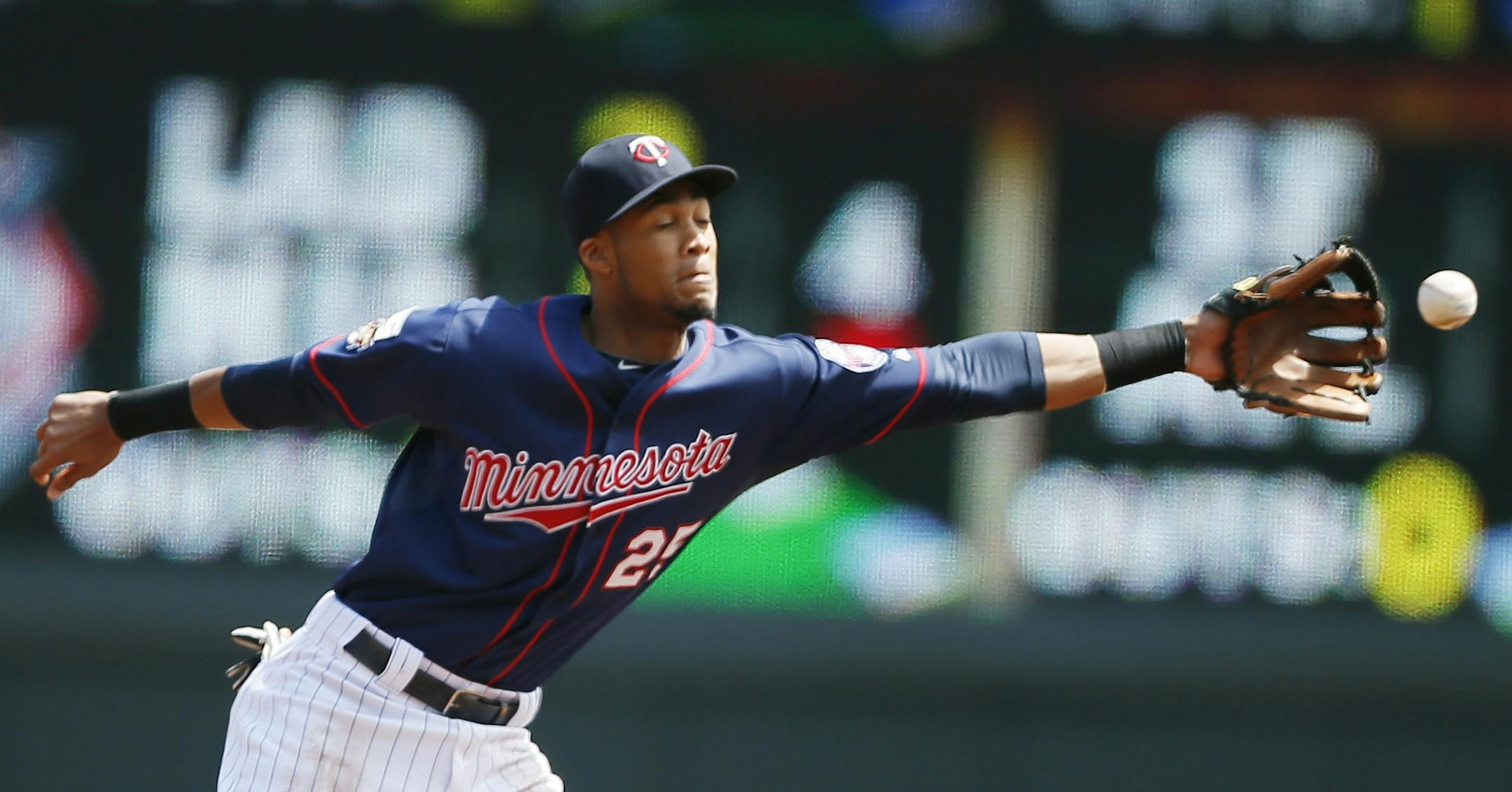 Minnesota Twins shortstop Pedro Florimon (25) was pulled off the base with a throw in the first inning during MLB action between the Minnesota Twins and Baltimore Orioles at Target Field May 4, 2014 in Minneapolis, MN.