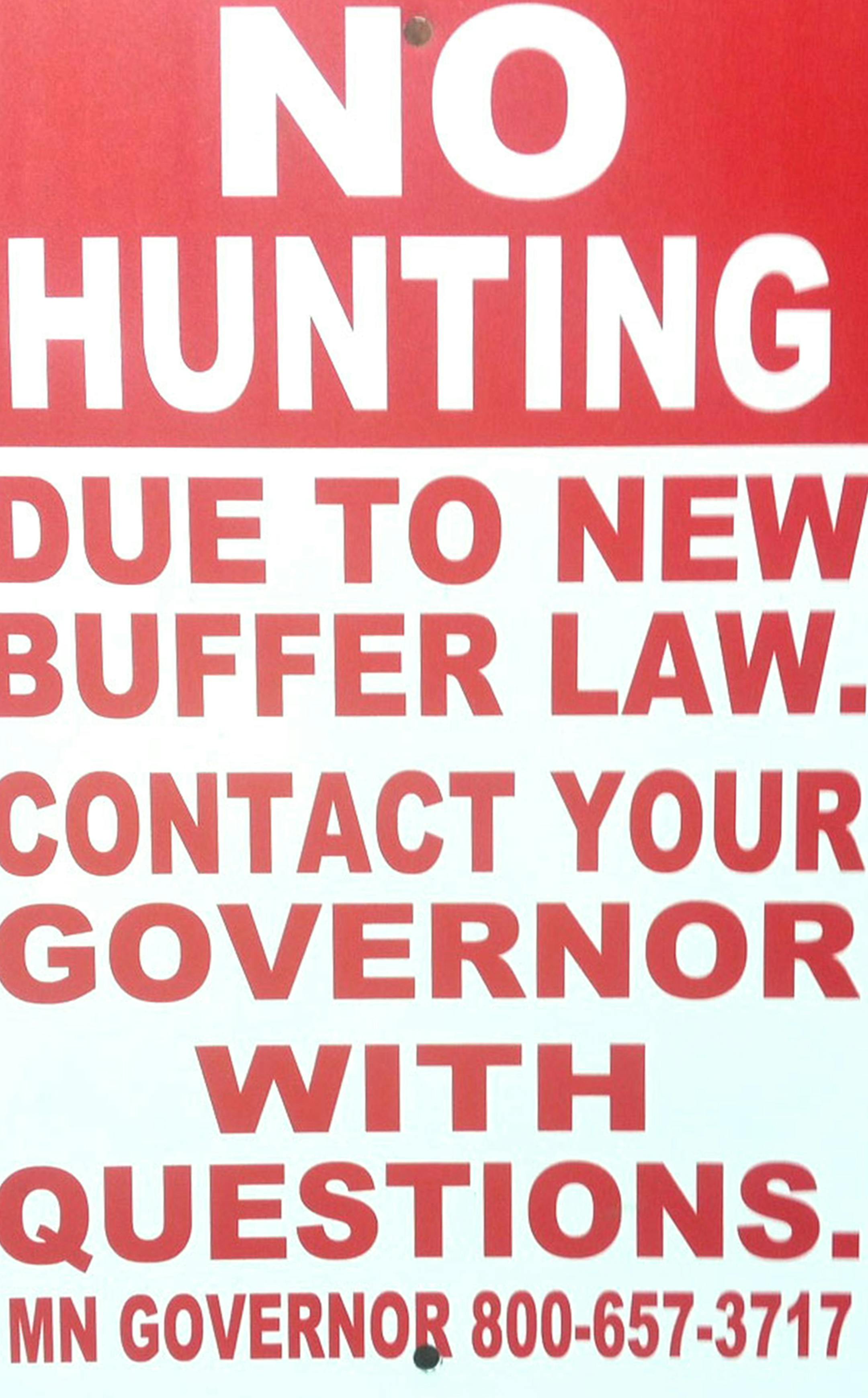 A smattering of signs like this are appearing in Minnesota farmlands this fall as a protest by some farmers over implementation of Gov. Mark Dayton's buffer initiative.