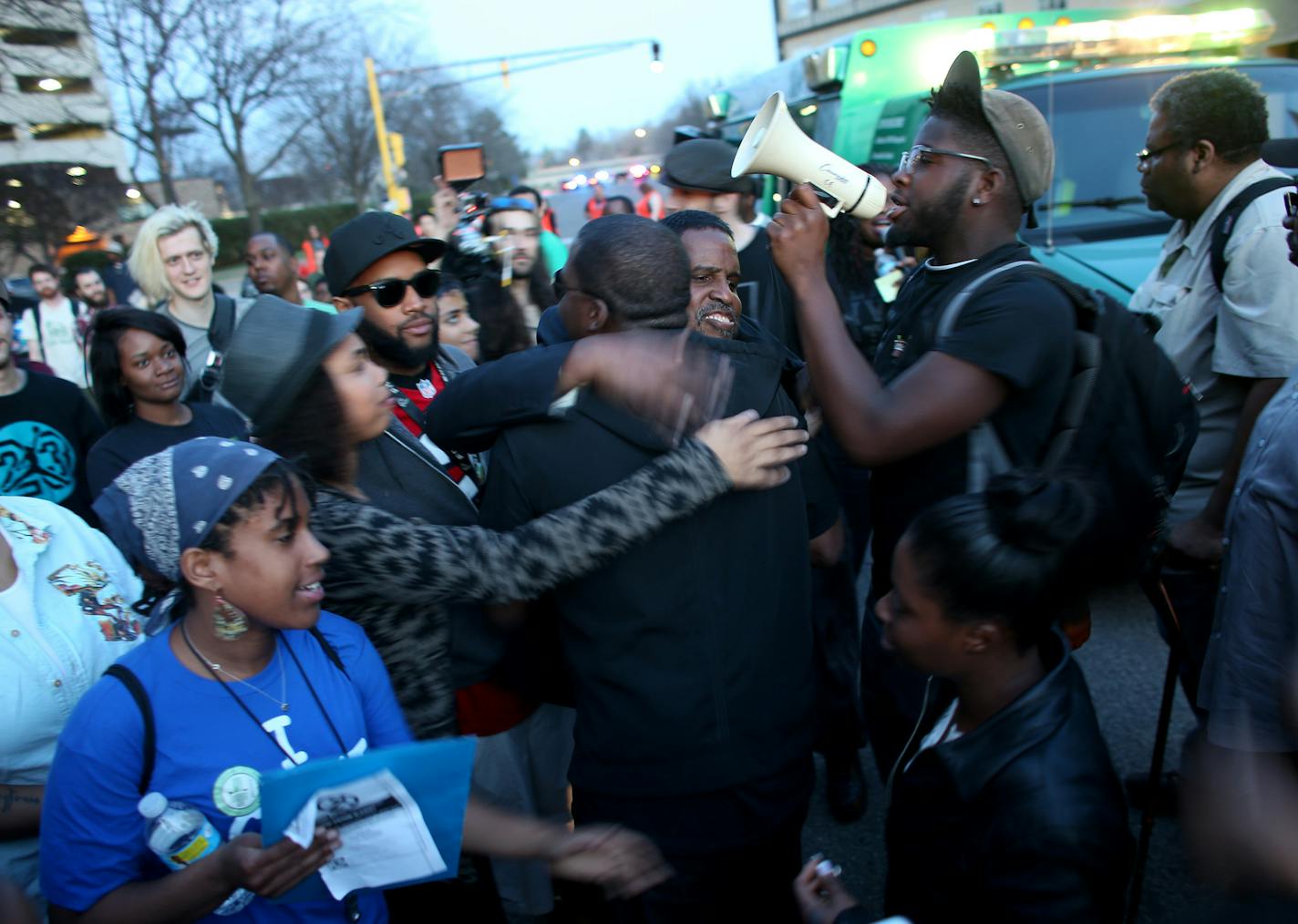 The family of Tania Harris got a group hug after they were able to she their daughter at North Memorial hospital where she was being treated from gunshot wounds. ] (KYNDELL HARKNESS/STAR TRIBUNE) kyndell.harkness@startribune.com during a rally held by Black Lives Matter at North Commons Park in Minneapolis Min., Friday, April 17, 2014.