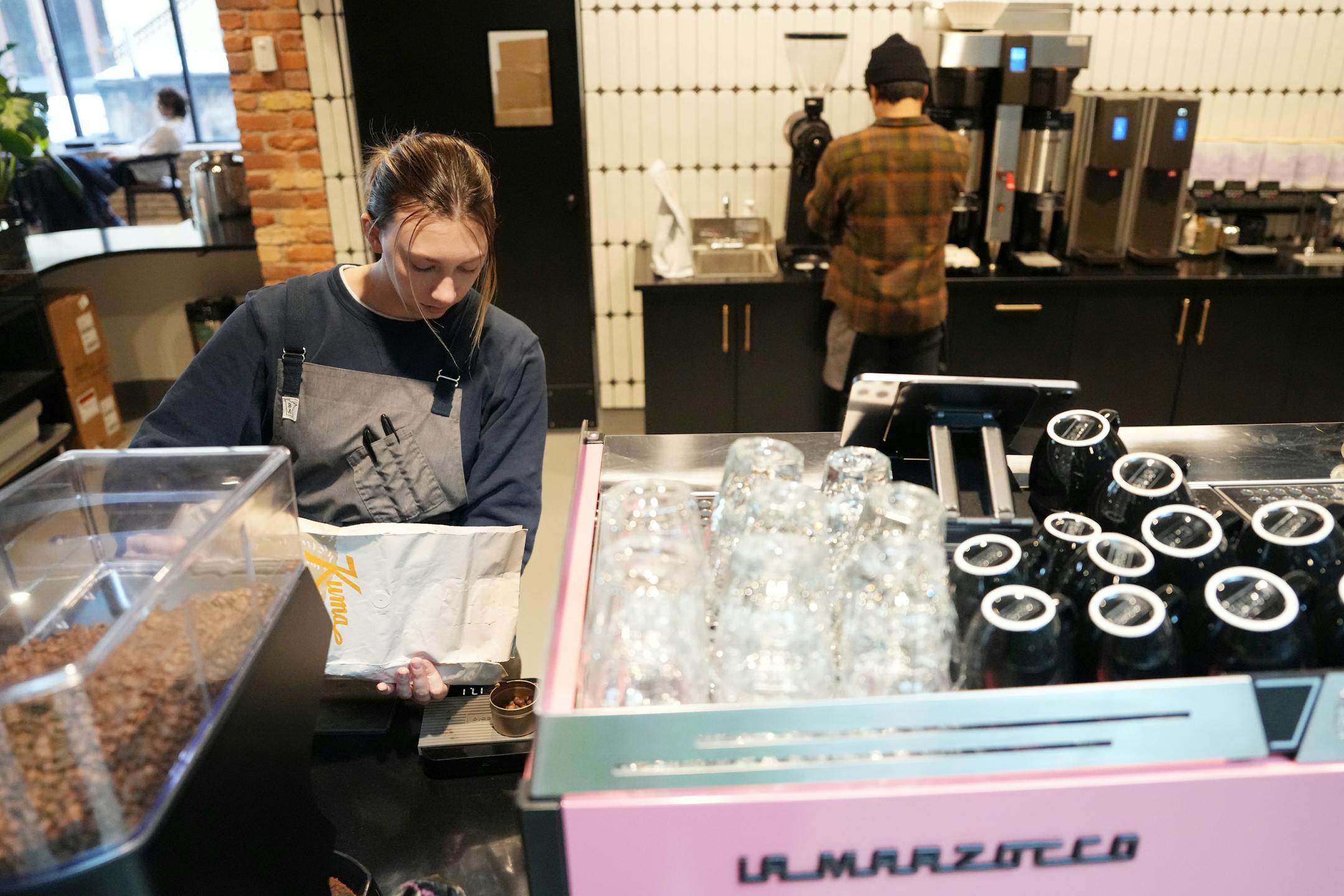 Staff make drinks at FRGMNT Coffee.