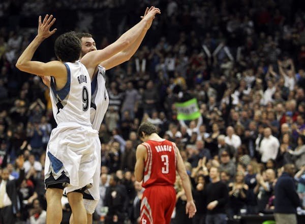 Ricky Rubio (9) and Kevin Love (42) celebrate a victory over Houston in February.
