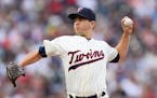 Minnesota Twins starting pitcher Tommy Milone (33) threw a pitch against the Yankees in the top of the first inning Saturday.