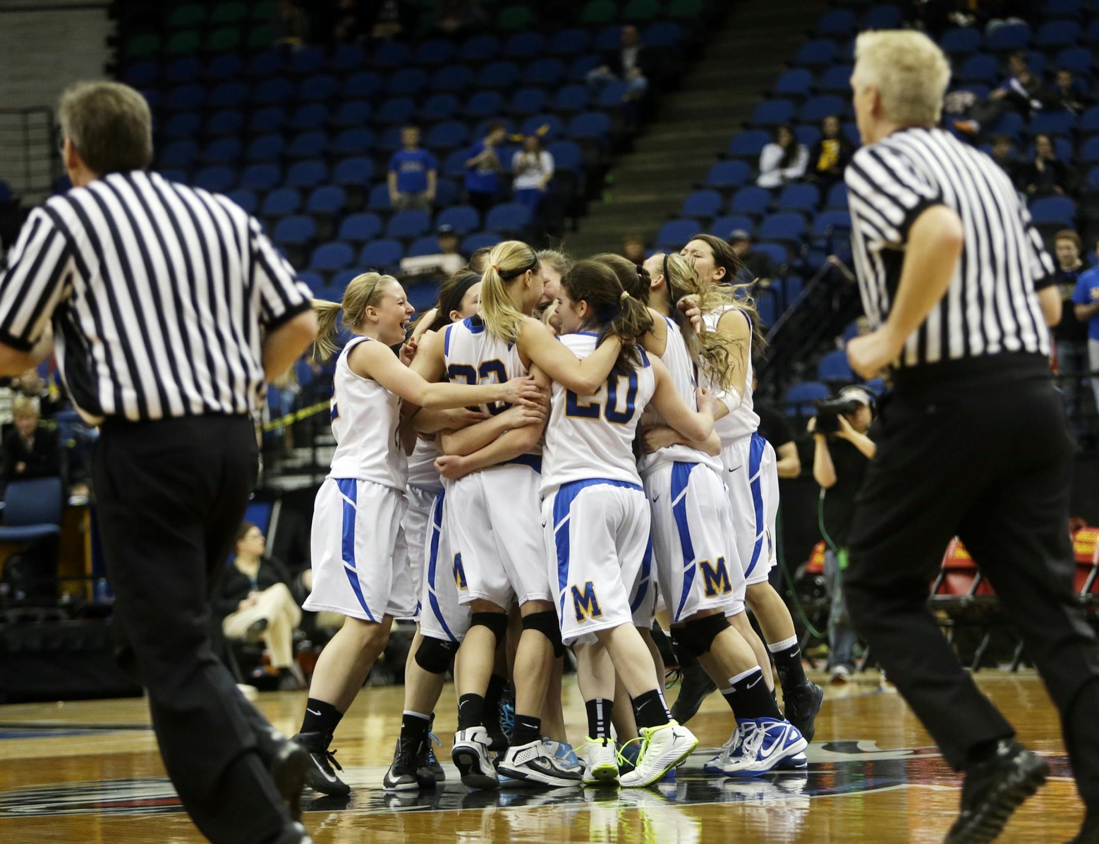Minneota players celebrate their 61-51 win over Ada-Borup in the girls basketball state tournament (class 1A) finals Saturday, March 16, 2013, at the Target Center in Minneapolis.