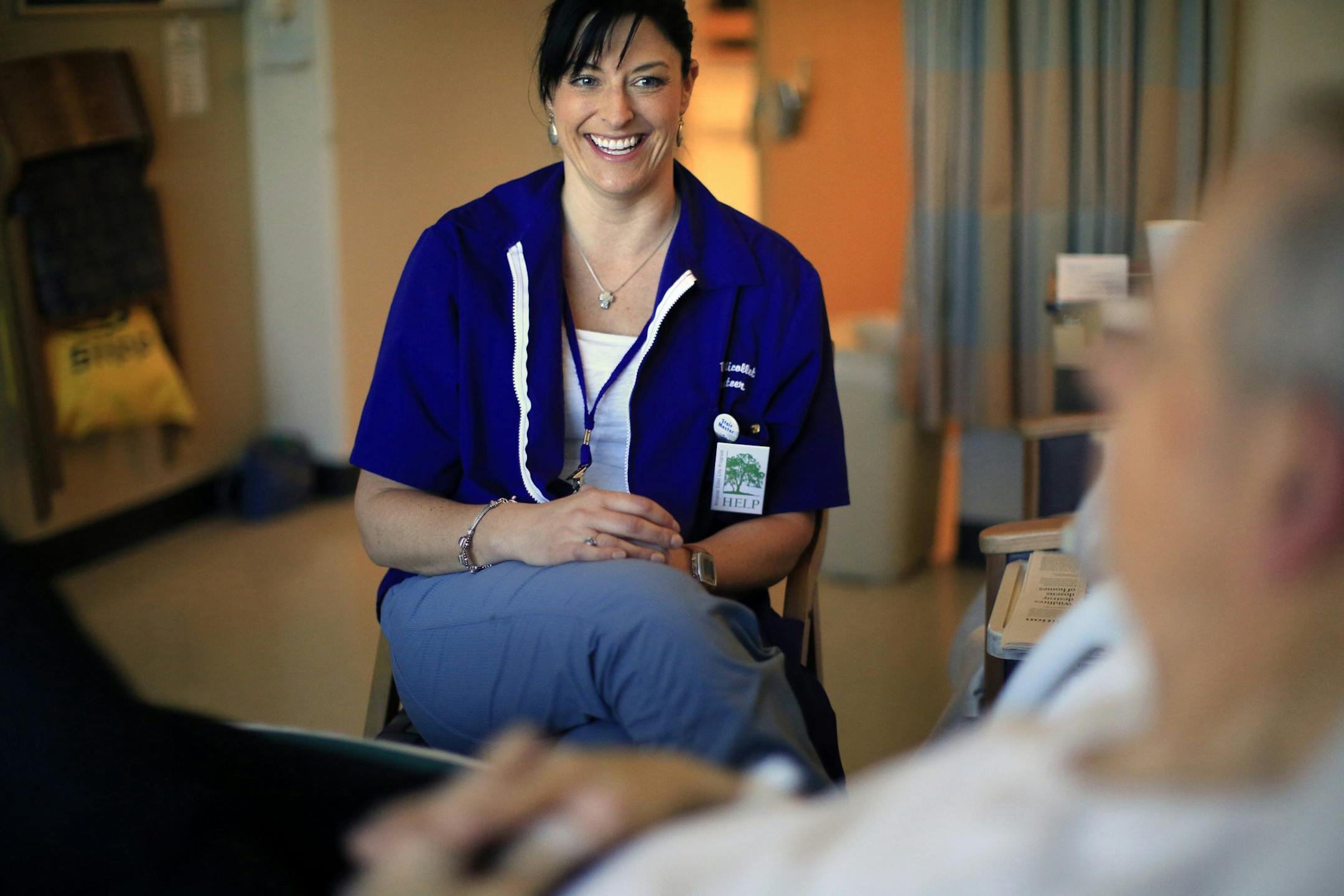 It's an open secret that many elderly patients become alarmingly confused in the hospital, even if they seemed perfectly normal at home. It's called hospital-acquired delirium, and even if it's temporary, it can complicate their treatment and recovery. At Park Nicollet's Methodist Hospital, they've found a way to curb the problem by assigning volunteers to stop by, play games and chat. Here, volunteer Mandi Shimek talks with Duane Jones, who was recovering from a hip replacement. ] BRIAN PETERSO