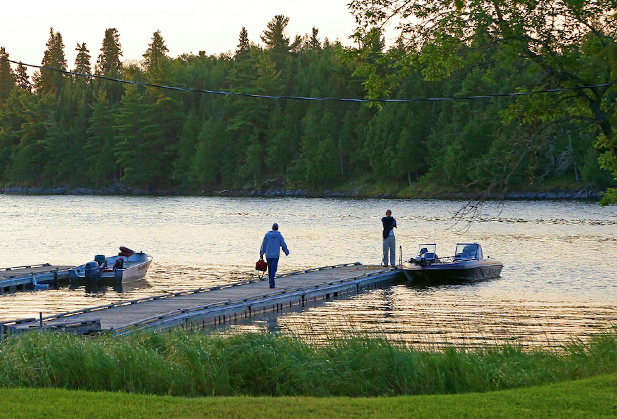 Rising before the sun, muskie anglers like to be on the water early. The dock at Big Narrows Resort on Lake of the Woods, about 25 miles by water from Kenora, Ontario, and a similar distance by water from Minnesota's Northwest Angle, welcomed these two fishermen on a recent day.