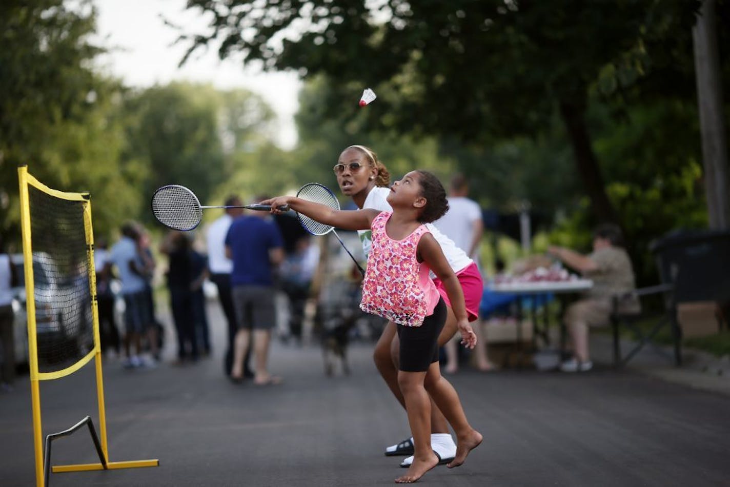 Olivia Carter 6, teamed up with Allina Starr for a game of badminton at the National Night Out block party in the 3400 block of Knox Avenue North Tuesday August 4, 2015 in Minneapolis, MN.