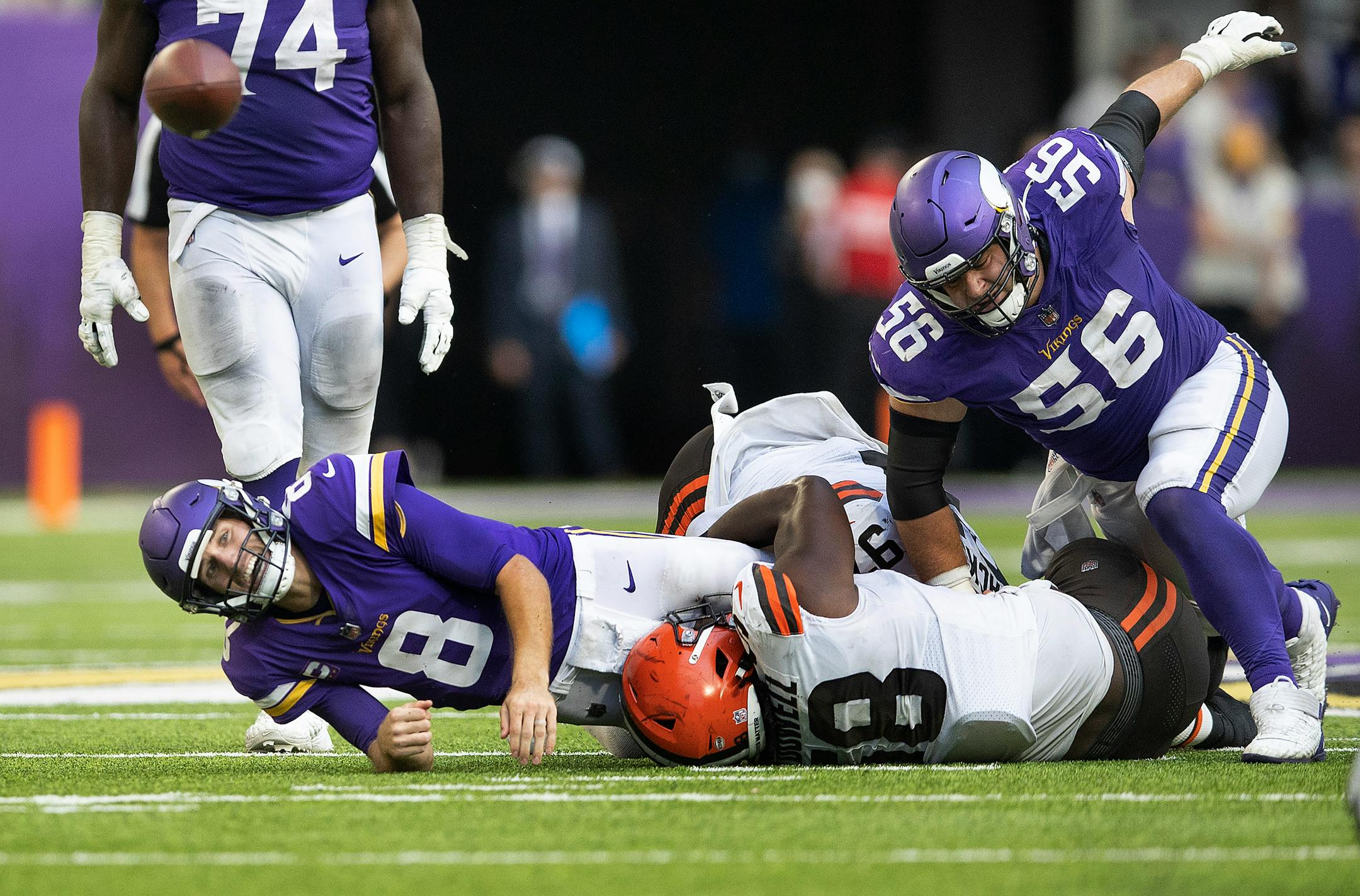 Minnesota Vikings quarterback Kirk Cousins (8) was forced into an incomplete pass by Cleveland Browns defensive tackle Malik McDowell (58) late in the fourth quarter.