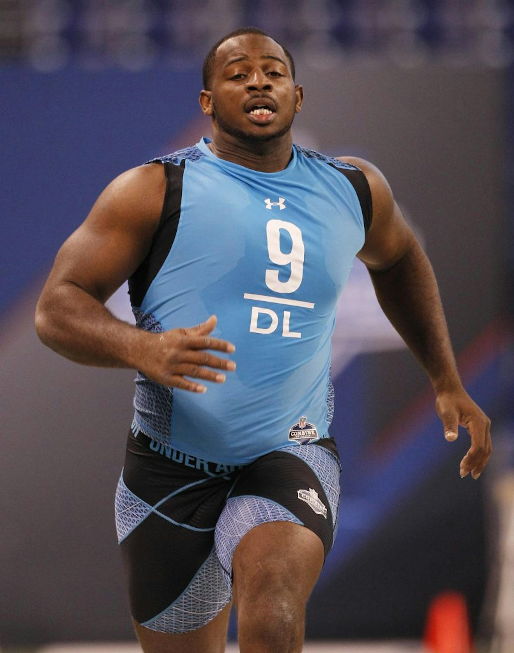 Mississippi State defensive lineman Fletcher Cox runs the 40-yard dash during a drill at the NFL football scouting combine in Indianapolis on Monday, Feb. 27, 2012.