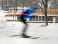 A cross country skier streaked past The Trailhead facility at Theodore Wirth Park which is under construction.