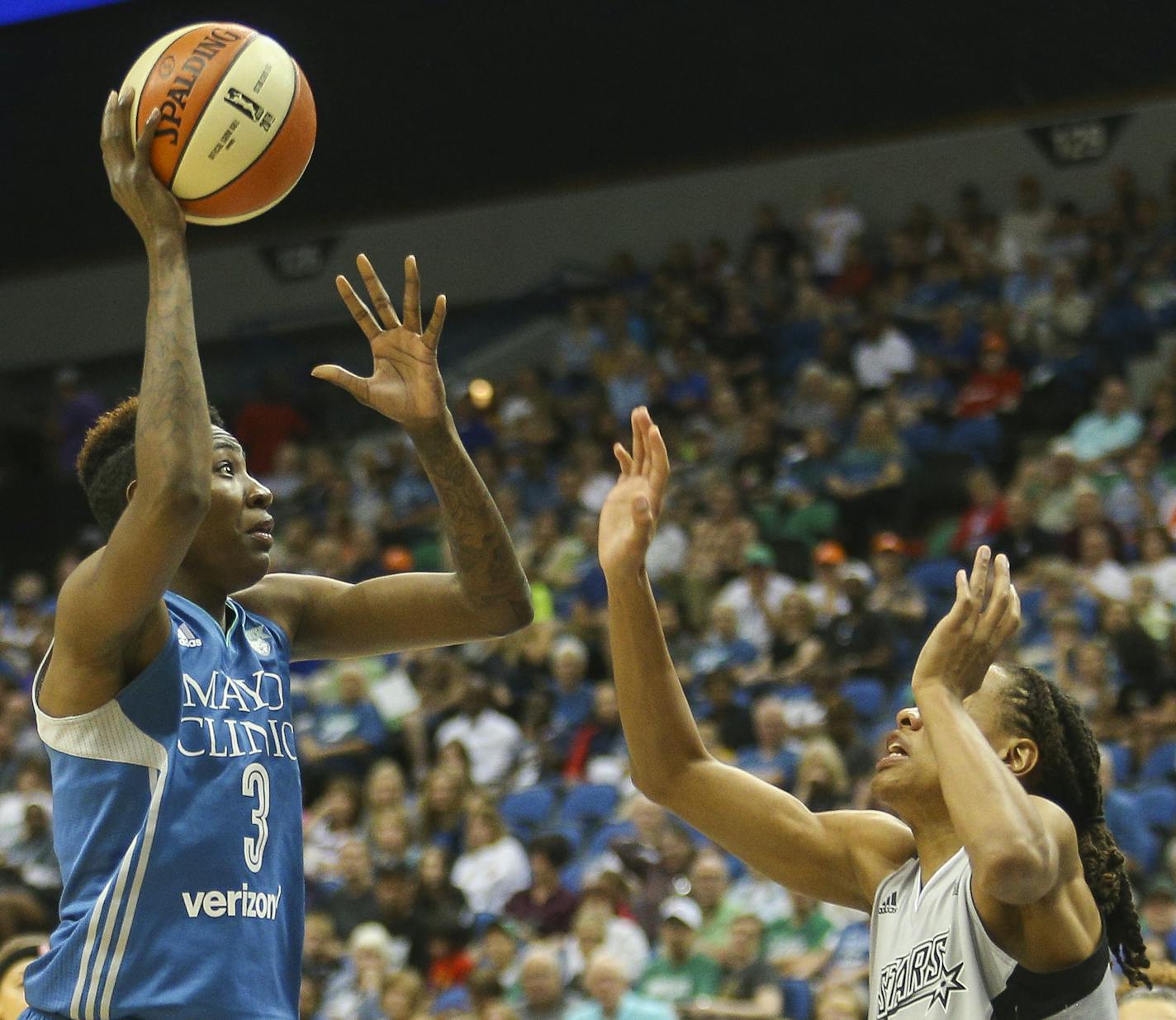 Minnesota Lynx forward Natasha Howard (3) attempts a one-handed jump shot over San Antonio Stars forward Monique Currie (1). ] Timothy Nwachukwu, Star Tribune &#x2022; Timothy.Nwachukwu@startribune.com The Minnesota Lynx play the San Antonio Stars on Saturday, July 2, 2016 at the Target Center in Minneapolis, Minn.