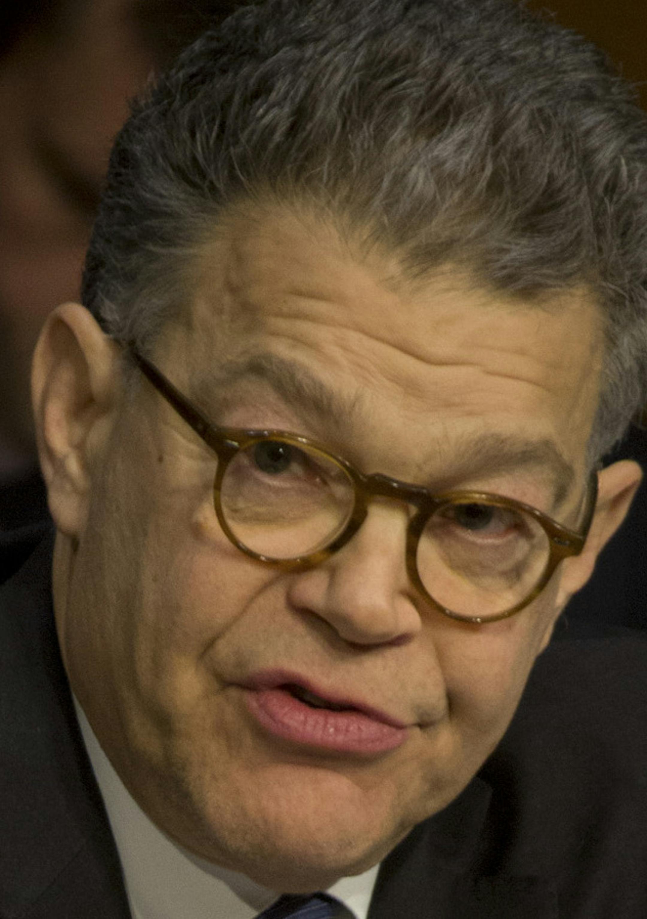 Sen. Al Franken (D-Minn.), who has been one of Comcast's most persistent critics, questions David Cohen, Comcast's executive vice president, during a Senate Judiciary hearing in Washington, April 9, 2014. Cohen, who has a reputation as an expert in big-picture strategy and fine detail, with political connections, is the point man for moving acquisitions like Time Warner Cable through regulatory hurdles. (Stephen Crowley/The New York Times) -- PHOTO MOVED IN ADVANCE AND NOT FOR USE - ONLINE OR IN