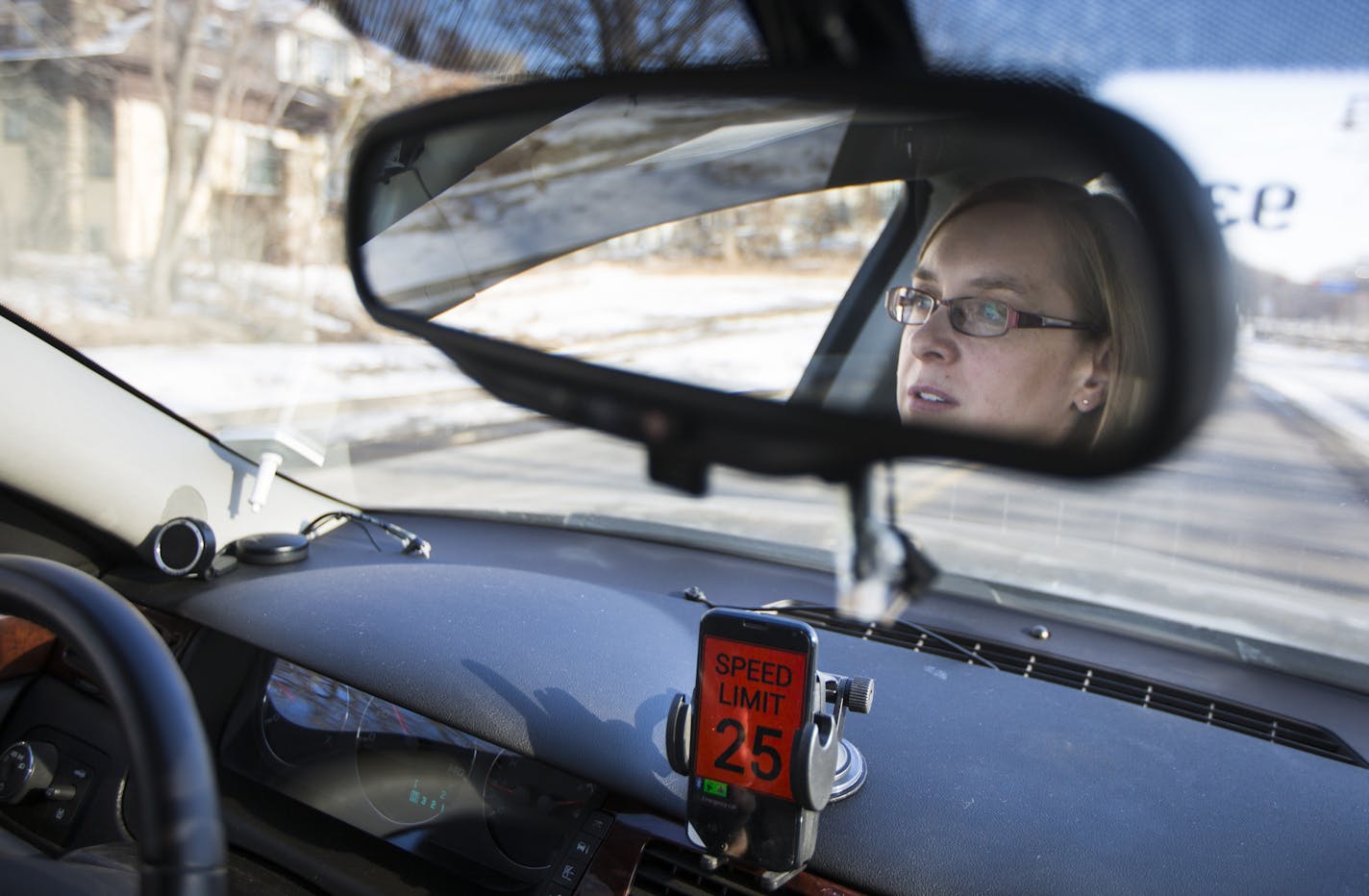 University of Minnesota research fellow Janet Creaser drove a car with a smartphone attached to the dashboard that monitored her driving (that turned red when she was speeding) on Thursday, February 5, 2015 in Minneapolis, Minn. The University of Minnesota's Center for Transportation Studies recently completed a study of 300 teens to determine ways to keep them focused while driving. The answer? A smartphone device in cars that disables teen phones in the car, and texts parents in real time if t