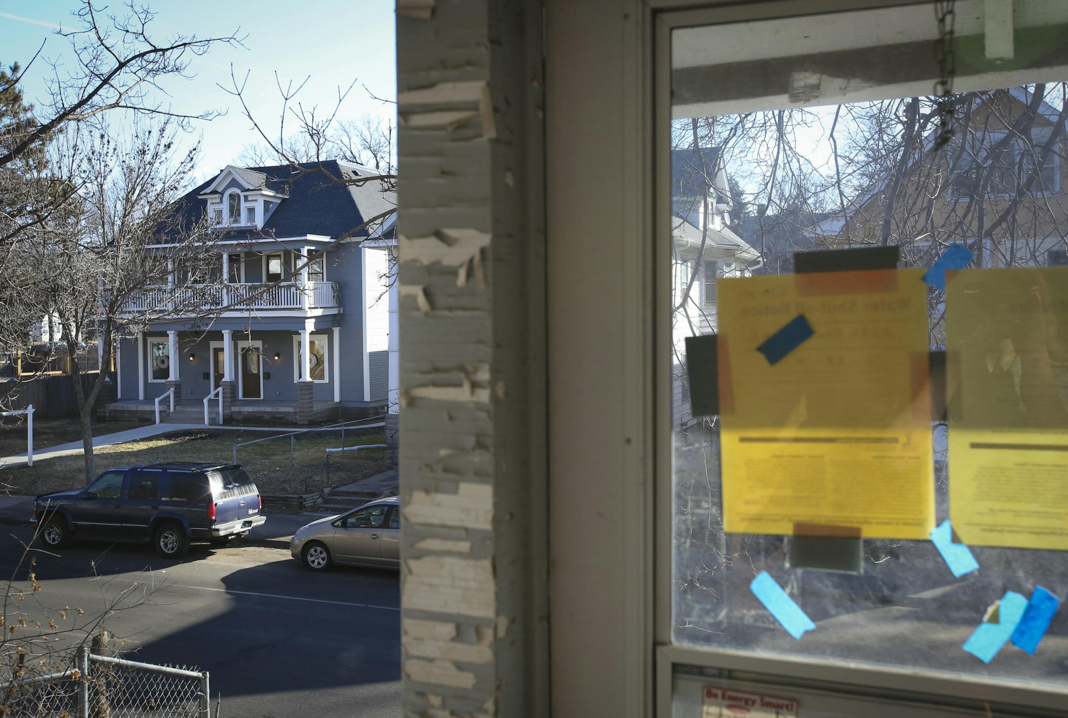 The completely renovated home Charlie Browning finished is across the street from another vacant home he wants to purchases and also renovate on Emerson Ave. N. in Minneapolis, Minn., on Friday, March 13, 2015. Photographed from the open porch of the vacant home ] RENEE JONES SCHNEIDER • reneejones@startribune.com