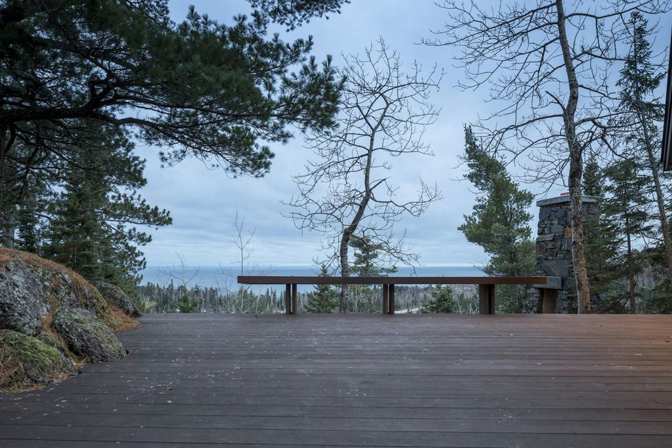 The Piepers watch ore boats cross Lake Superior from a side deck.