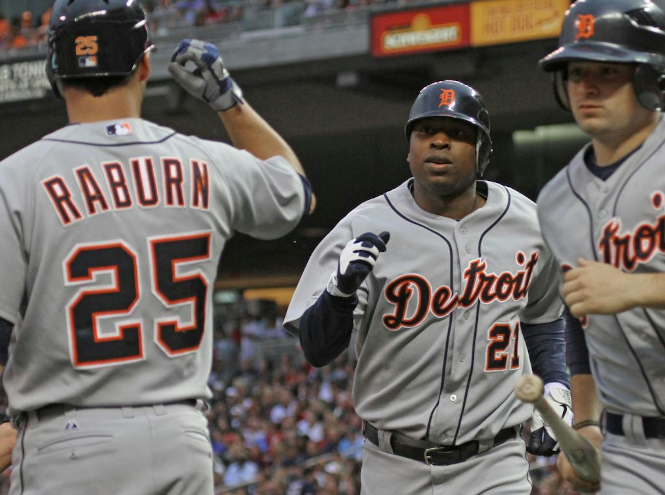Minnesota Twins vs. Detroit Tigers, 5/25/12. (left to right) Detroit's Ryan Raburn and Delmon Young celebrated after Young scored a 2nd inning run.