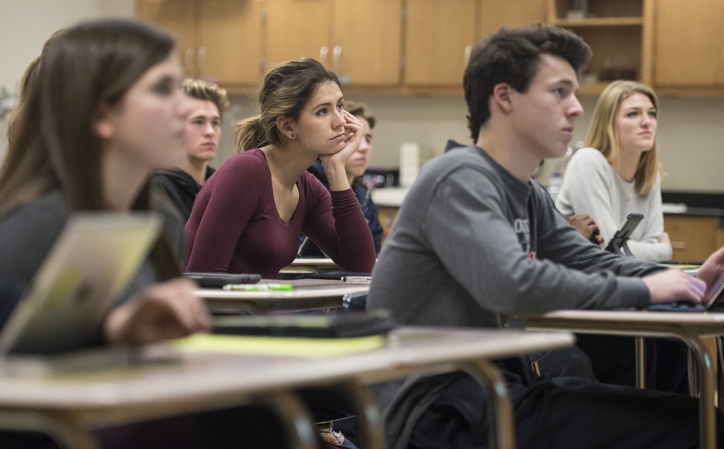 Students in Mr. Ben Froehling's chemistry class paid attention to his lecture late in Tuesday's school day. ] (AARON LAVINSKY/STAR TRIBUNE) aaron.lavinsky@startribune.com Wayzata public schools became the latest Minnesota district to "flip" start times so that high school students can sleep later and grade-schoolers get on the bus earlier. The vote came at an emotional meeting that reflected divisions among parents over academic quality, family time and busy working parents. Advocates say these