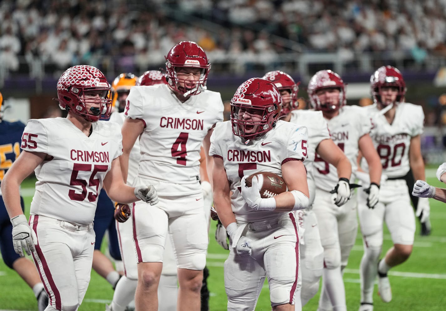 Maple Grove linebacker Tanner Albeck (5) celebrates after scoring a touchdown in the first half against Rosemount in the Class 6A Prep Bowl at U.S. Bank Stadium.