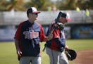 Twins coach Paul Molitor left and manger Ron Gardenhire shared a laugh after the first day of spring training Monday Feb 17. 2014 in Fort Myers, Flori